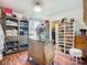 Spacious walk-in closet with custom shelving, shoe racks and a marble topped island at 9019 39Th Street Cir E, Parrish, FL 34219