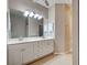 Bathroom featuring double sink vanity, large mirror and great lighting at 912 Barclay Ct, Venice, FL 34293