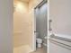 Bathroom featuring a walk-in shower and accessibility handrails for safety and convenience at 912 Barclay Ct, Venice, FL 34293
