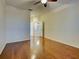 Large bedroom with hardwood floors, ceiling fan, and ample space at 912 Barclay Ct, Venice, FL 34293