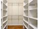 Walk-in closet with adjustable shelving for maximum organization and storage at 912 Barclay Ct, Venice, FL 34293