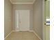 Bright entryway featuring neutral tones, tile flooring, and a sidelight window at 912 Barclay Ct, Venice, FL 34293