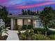 Charming home with a landscaped front yard, walkway and tiled roof at 912 Barclay Ct, Venice, FL 34293