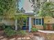 Home exterior featuring a screened porch, walkway and lush landscaping at 912 Barclay Ct, Venice, FL 34293