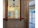 Kitchen bar area featuring wood trim, pendant lighting, and kitchen views at 912 Barclay Ct, Venice, FL 34293