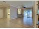 Living room with view of kitchen bar and access to the outdoor patio at 912 Barclay Ct, Venice, FL 34293
