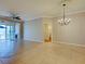 Open living room with tile flooring, neutral walls, and entry to adjacent rooms at 912 Barclay Ct, Venice, FL 34293