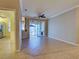 Living room view of bar to kitchen, neutral paint, and sliding doors to outdoor patio at 912 Barclay Ct, Venice, FL 34293