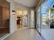 Patio with open sliding glass doors to the inside and enclosed sliding glass doors to the yard at 912 Barclay Ct, Venice, FL 34293