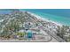 Coastal scene of colorful buildings lining beach and blue waters at 9220 43Rd W Ter, Bradenton, FL 34209