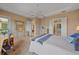 Bedroom featuring desk, dresser, and doorway leading to a large walk-in closet at 9220 43Rd W Ter, Bradenton, FL 34209
