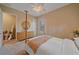 Serene bedroom featuring a four-poster bed, dresser, and neutral decor at 9220 43Rd W Ter, Bradenton, FL 34209