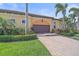 Attractive single-story home featuring a brick driveway, tile roof, mature landscaping and 2-car garage at 9220 43Rd W Ter, Bradenton, FL 34209