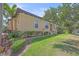 Attractive single-story home featuring a tile roof, mature landscaping, and well maintained lawn at 9220 43Rd W Ter, Bradenton, FL 34209