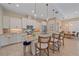 Gourmet kitchen features granite countertops, stainless appliances, tile backsplash, and an island with seating at 9220 43Rd W Ter, Bradenton, FL 34209