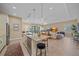 Bright kitchen with a center island, breakfast bar, open to living area, and stainless steel appliances at 9220 43Rd W Ter, Bradenton, FL 34209
