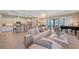 Spacious living room featuring an open concept, natural light, and views of the kitchen and outdoor patio at 9220 43Rd W Ter, Bradenton, FL 34209