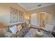 Cozy living area featuring a patterned sofa, modern art, and an open archway at 9220 43Rd W Ter, Bradenton, FL 34209