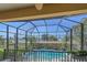 Screened-in lanai featuring a swimming pool and privacy landscaping at 9220 43Rd W Ter, Bradenton, FL 34209