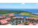 Waterfront community with condos, surrounding lakes, greenery, and ocean views at 97 Vivante Blvd # 306, Punta Gorda, FL 33950