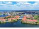 Panoramic aerial view shows the waterfront condo community, complete with lakes and lush green spaces, with ocean view at 97 Vivante Blvd # 306, Punta Gorda, FL 33950