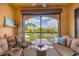 Outdoor balcony with seating offers nice views of community and tropical landscaping at 97 Vivante Blvd # 306, Punta Gorda, FL 33950