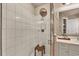 Clean bathroom featuring a tiled shower, and white vanity with modern fixtures at 97 Vivante Blvd # 306, Punta Gorda, FL 33950