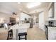 Modern kitchen with stainless steel appliances, white cabinetry, and open to the living room at 97 Vivante Blvd # 306, Punta Gorda, FL 33950