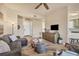 Spacious living room with comfortable furniture, ceiling fan, and open access to other rooms at 97 Vivante Blvd # 306, Punta Gorda, FL 33950