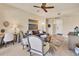 Inviting living room with stylish decor, ceiling fan, natural light, and comfortable seating at 97 Vivante Blvd # 306, Punta Gorda, FL 33950