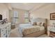 A serene main bedroom with plush carpeting, natural light, and a neutral color palette at 97 Vivante Blvd # 306, Punta Gorda, FL 33950