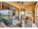 Relaxing outdoor patio with comfortable seating and views of the community and lush landscaping at 97 Vivante Blvd # 306, Punta Gorda, FL 33950