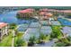 Aerial view of multiple well-maintained tennis courts within a scenic waterfront community at 97 Vivante Blvd # 306, Punta Gorda, FL 33950