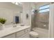Bright bathroom featuring a bathtub/shower combination with tiled walls and a modern vanity at 9823 Haze Dr, Venice, FL 34292