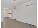 Bedroom showcasing tile floors, closet, and doorway at 9823 Haze Dr, Venice, FL 34292