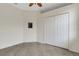 Bright bedroom features a ceiling fan, neutral paint, and closet for ample storage at 9823 Haze Dr, Venice, FL 34292