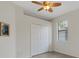 Bedroom showcasing closet, window and ceiling fan at 9823 Haze Dr, Venice, FL 34292