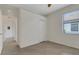 Bedroom features tile flooring, a closet, and natural light from the window at 9823 Haze Dr, Venice, FL 34292