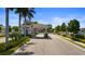 Elegant gated community entrance with lush landscaping and a welcoming entryway, enhancing curb appeal at 9823 Haze Dr, Venice, FL 34292