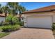Charming home with a two-car garage and meticulously maintained landscaping at 9823 Haze Dr, Venice, FL 34292