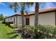 Charming home with palm trees and manicured bushes at 9823 Haze Dr, Venice, FL 34292