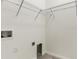 Well-lit laundry room includes shelving and hookups for a washer and dryer at 9823 Haze Dr, Venice, FL 34292