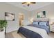 Comfortable main bedroom with a neutral color palette and en-suite bathroom at 9823 Haze Dr, Venice, FL 34292