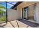 Screened-in patio with brick flooring offers a seamless transition to indoor spaces at 9823 Haze Dr, Venice, FL 34292