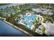 Breathtaking aerial view of a community pool and clubhouse, showcasing tennis courts and picturesque surroundings at 10121 Beachwalk Dr, Englewood, FL 34223