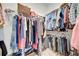 Walk-in closet with metal shelving and rods for ample storage space at 10121 Beachwalk Dr, Englewood, FL 34223