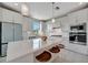 Bright kitchen features a large island, modern appliances, and plenty of cabinet space at 10121 Beachwalk Dr, Englewood, FL 34223