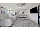 Open-concept living space with shiplap wall accents, recessed lighting, and a comfortable seating area at 10121 Beachwalk Dr, Englewood, FL 34223
