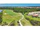 A golf course home with a lovely screened-in lanai overlooks a lush green space and a serene waterway at 102 Mestre Pl, North Venice, FL 34275