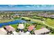 A vast aerial view of the community showcasing ponds, golf courses, and homes at 102 Mestre Pl, North Venice, FL 34275